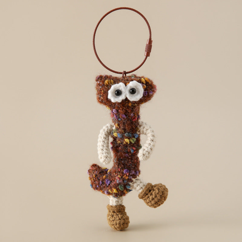Alphabet Amigos Keychains - Handmade Monogram Charms featuring a knitted brown letter J with eyes and boots