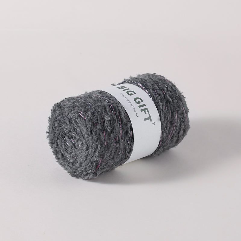 Artisan wool blend for crochet by 不二手作 in dark gray with subtle pink accents