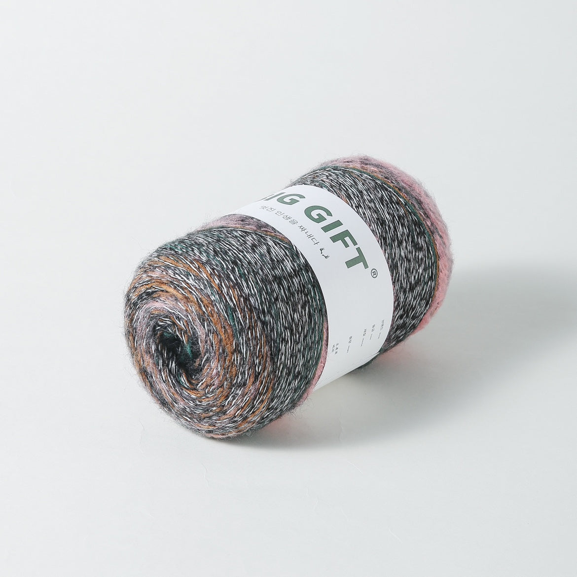 Skeined artisan wool blend for crochet yarn in mixed colors with label on white background