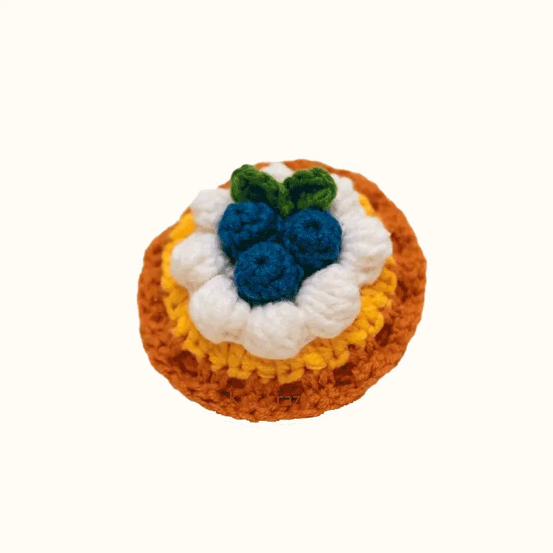 Crochet blueberry tart pattern by The Knit Krazy featuring detailed blueberries and cream on a golden crust