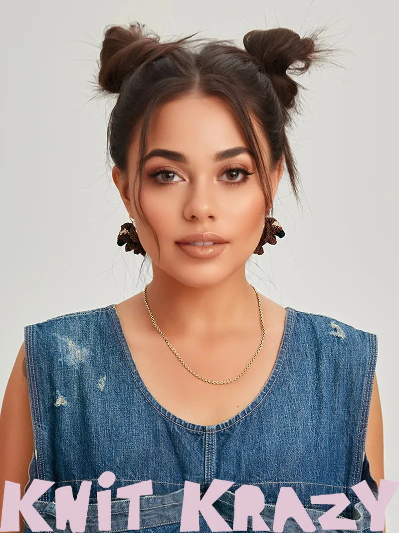 Woman wearing dachshund crochet earrings paired with a denim sleeveless top and gold chain necklace