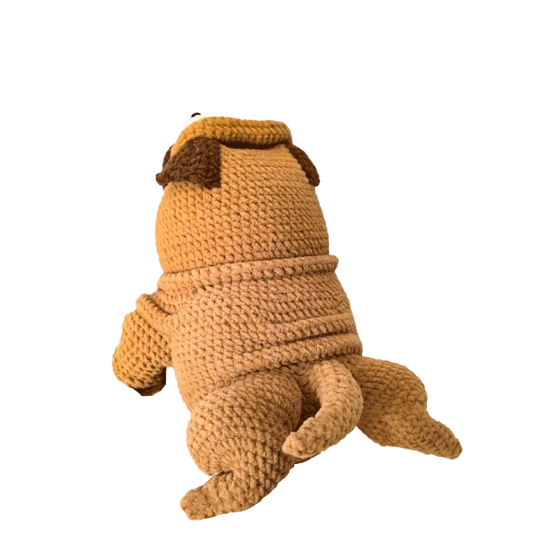 Handmade crochet pug doll shown from the back using crochet pug doll pattern in brown yarn