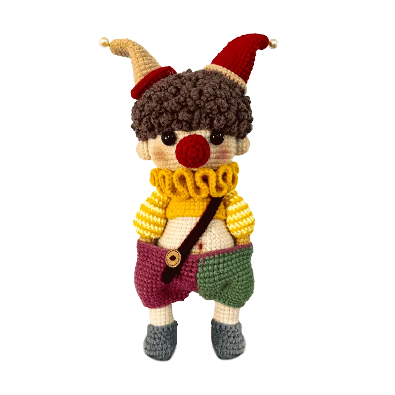 Handmade crochet clown doll with colorful hat and striped sweater for DIY amigurumi clown tutorial