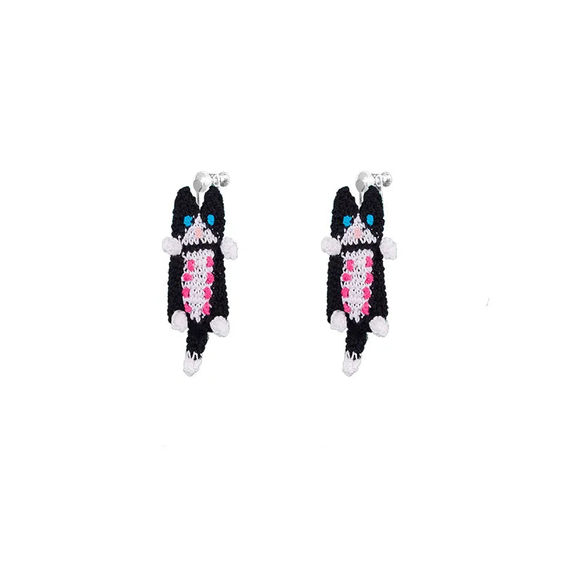 Colorful handmade cat earrings with purple and white designs by 小黄香蕉