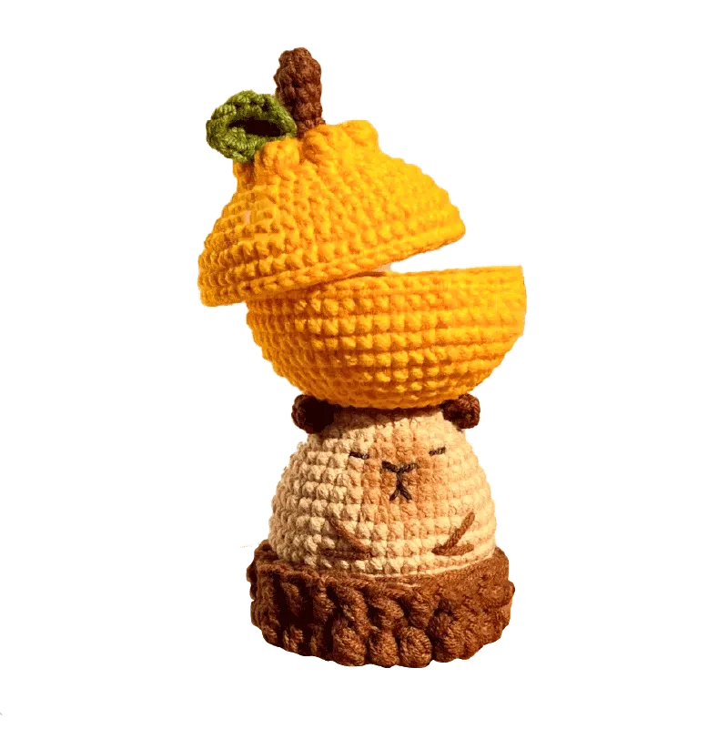 Handmade crochet capybara storage box with yellow acorn lid using crochet capybara storage box pattern