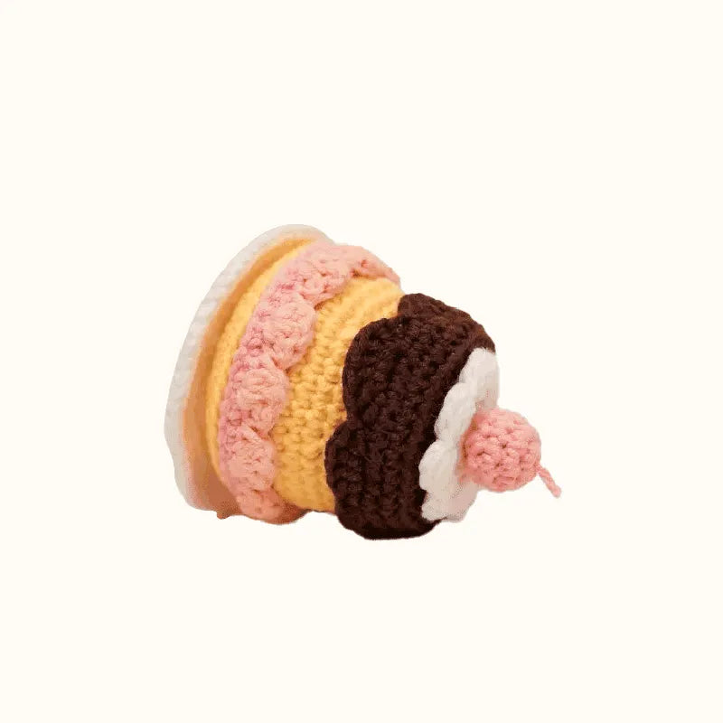 Handcrafted crochet caramel pudding pattern with pink, yellow, brown, and white yarn details