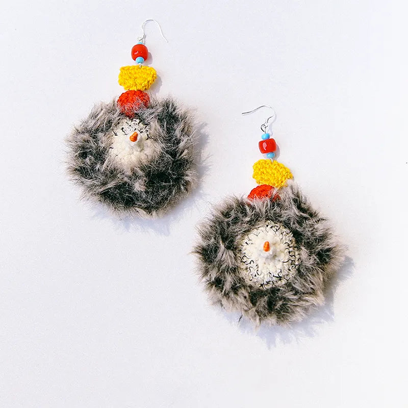 The Knit Krazy handmade hedgehog keychain with fluffy grey fur and colorful bead accents