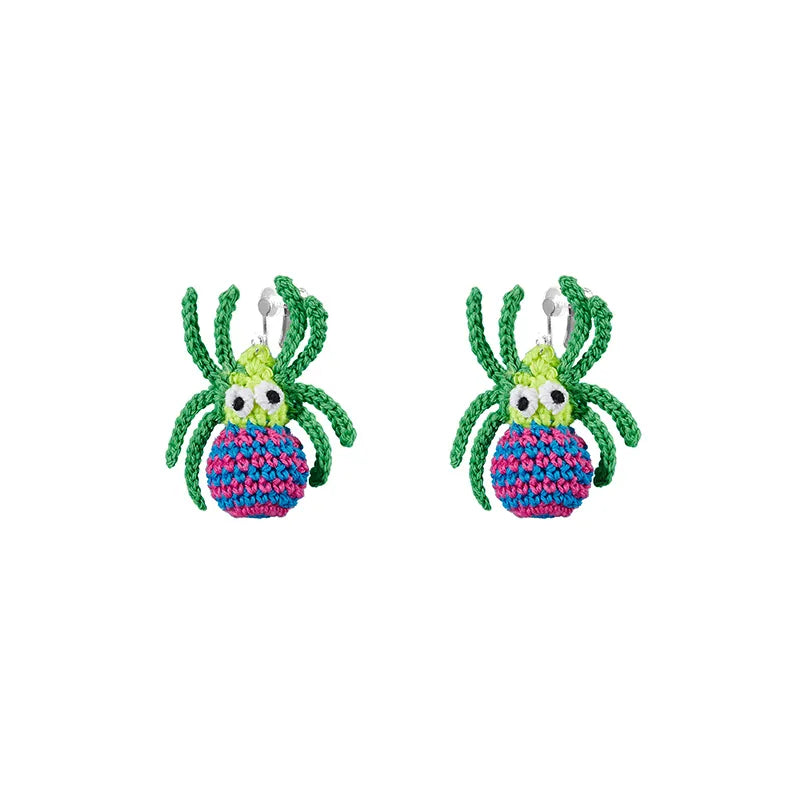 Handmade spider web earrings by The Knit Krazy featuring colorful crocheted spider design