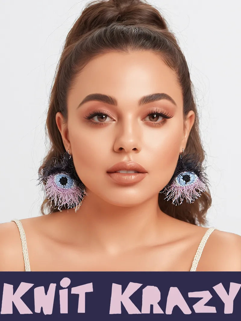 Handmade surrealist eye earrings by 小黄香蕉 worn by model with light makeup and pulled back hair