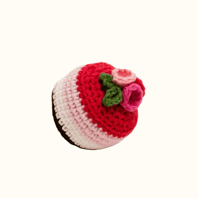 Crocheted cupcake with red and pink layers and green leaves raspberry mousse crochet tutorial