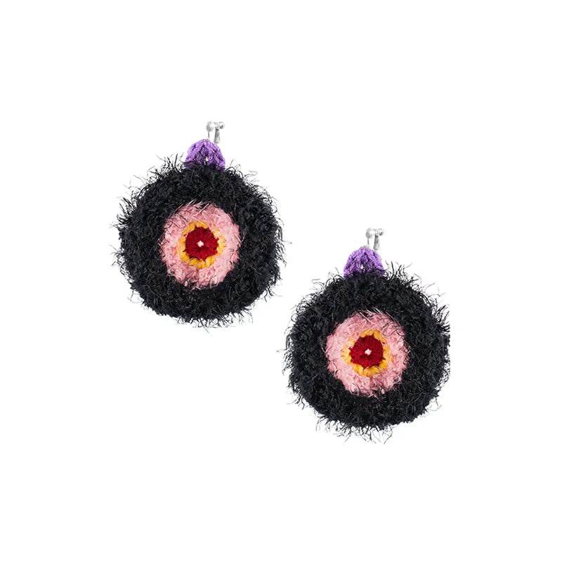 Unique handmade earrings featuring black fuzzy circular design with pink and red center and purple top detail