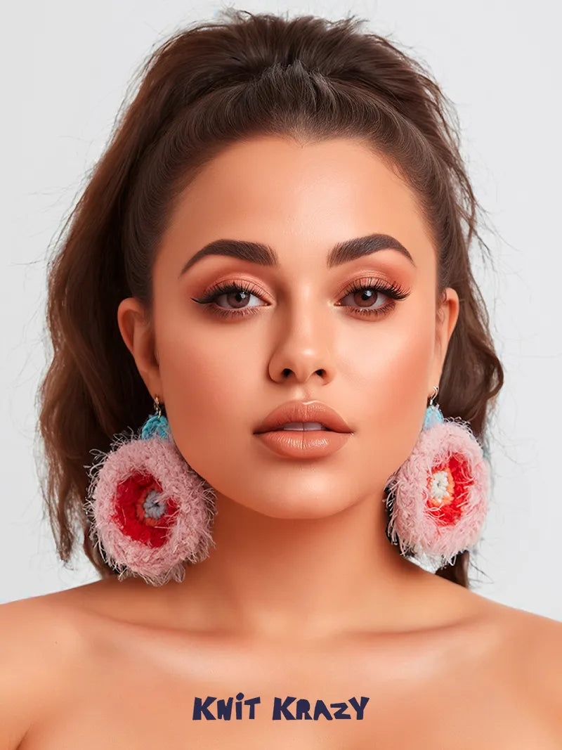 Unique handmade earrings by Xiao Huang Banana featuring colorful knitted floral design on model