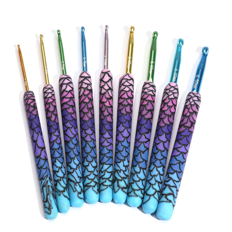 Set of ergonomic crochet supplies with colorful gradient handles and metal hooks for comfortable crafting