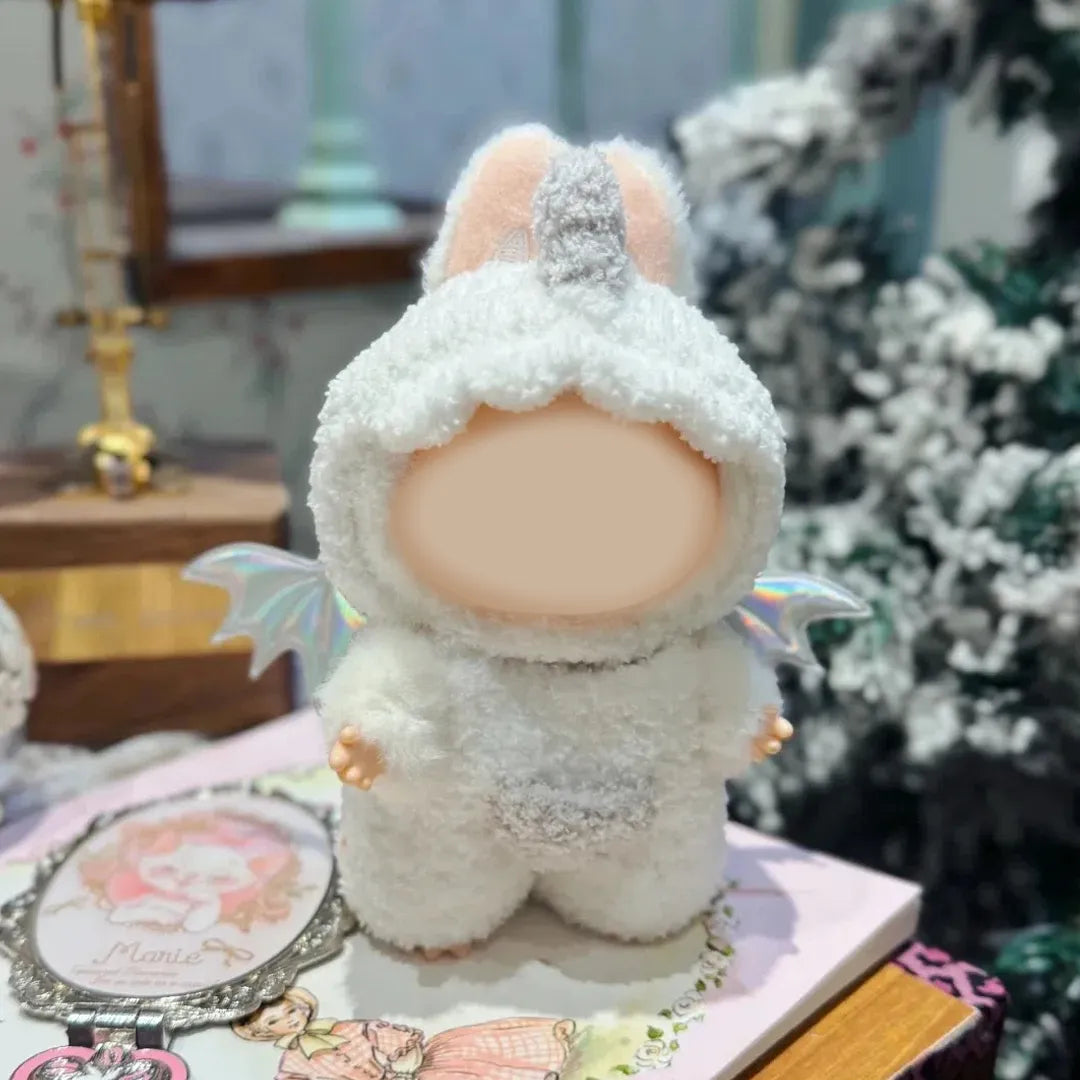 Cute doll dressed in a handmade angel costume crochet pattern with fluffy white wings and hood