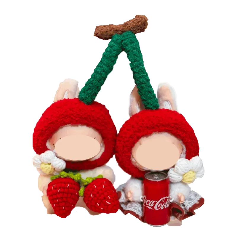 Cherry-themed crochet outfit for plushies featuring red cherry hats with green stems and white flowers