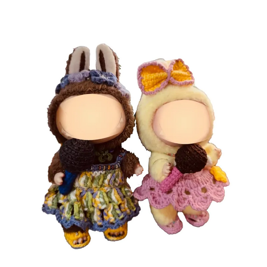 Collectible crochet doll patterns featuring two handmade dolls dressed in colorful crocheted outfits