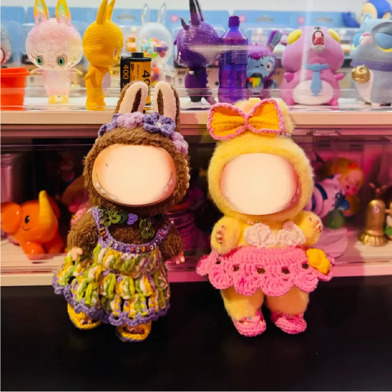Collectible crochet doll patterns featuring two handmade dolls in colorful outfits with bunny and bow designs