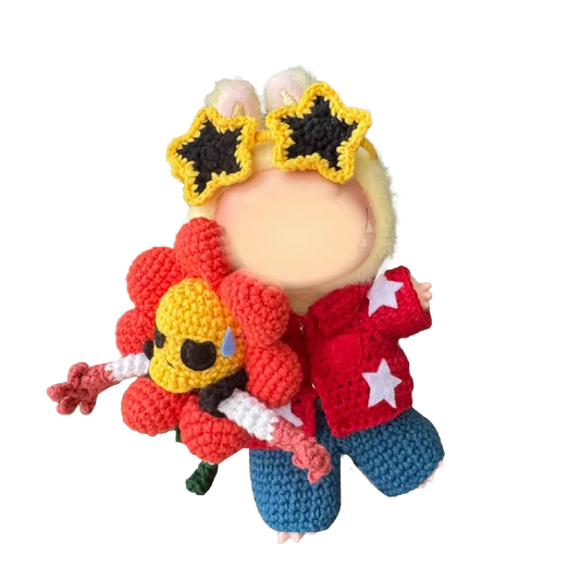 Redbook collectible doll crochet design featuring a figure with star sunglasses and a colorful flower accessory