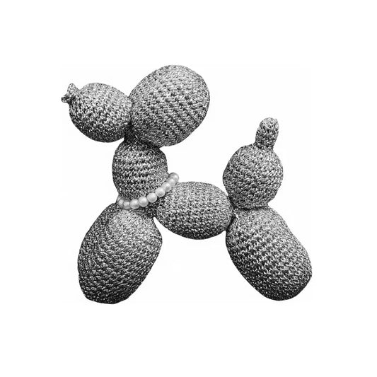 Crochet balloon dog pattern showing a textured crocheted dog figure with pearl collar