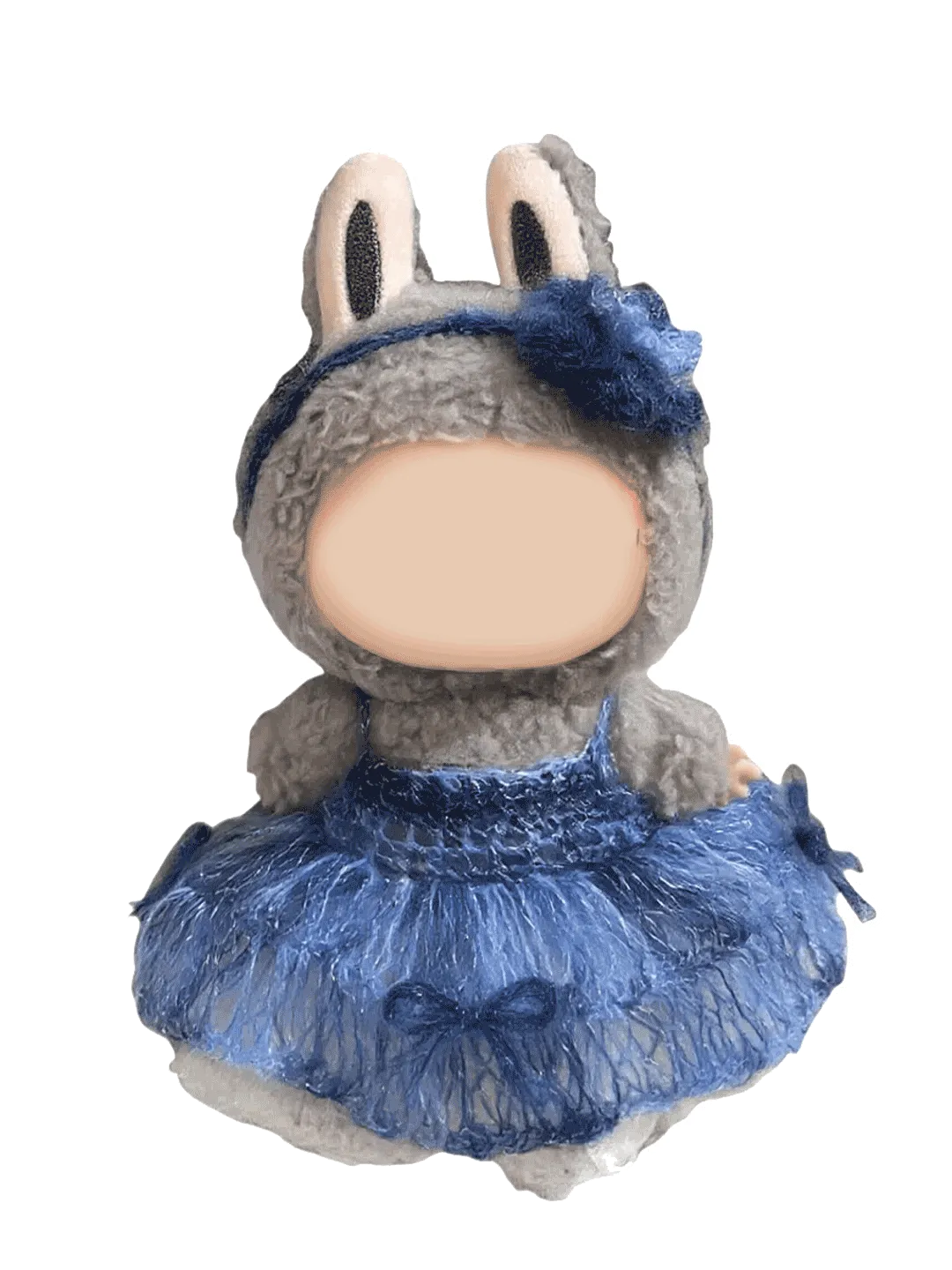 Handmade crochet doll wearing a blue crochet doll dress pattern with a flower headband and bunny ears