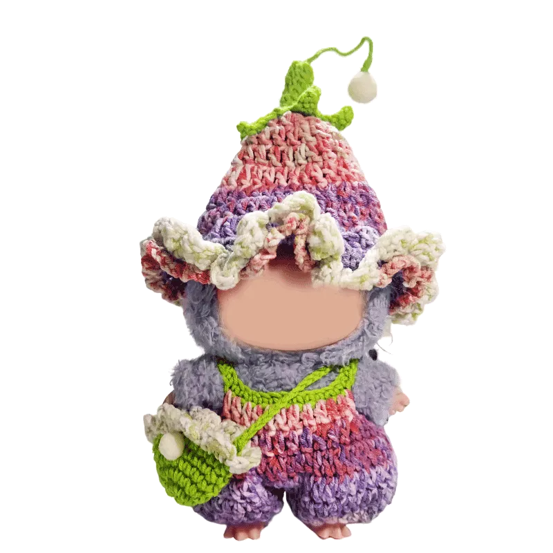 Crochet doll wearing a colorful handmade outfit with hat and bag crochet doll outfit pattern