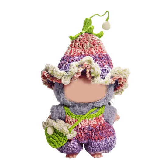 Crochet doll wearing a colorful handmade outfit with hat and bag crochet doll outfit pattern