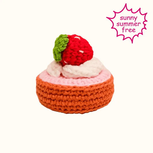 Crochet French tart pattern featuring a detailed crocheted strawberry and cream on a tart base
