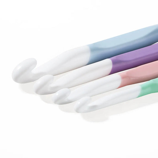 Set of ergonomic crochet hooks for bulky yarn in pastel colors with comfortable grips