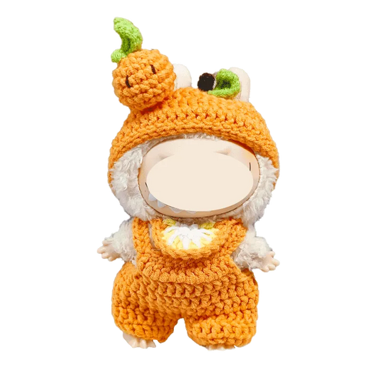 Crochet orange plush outfit pattern on a white stuffed animal with pumpkin hat and overalls