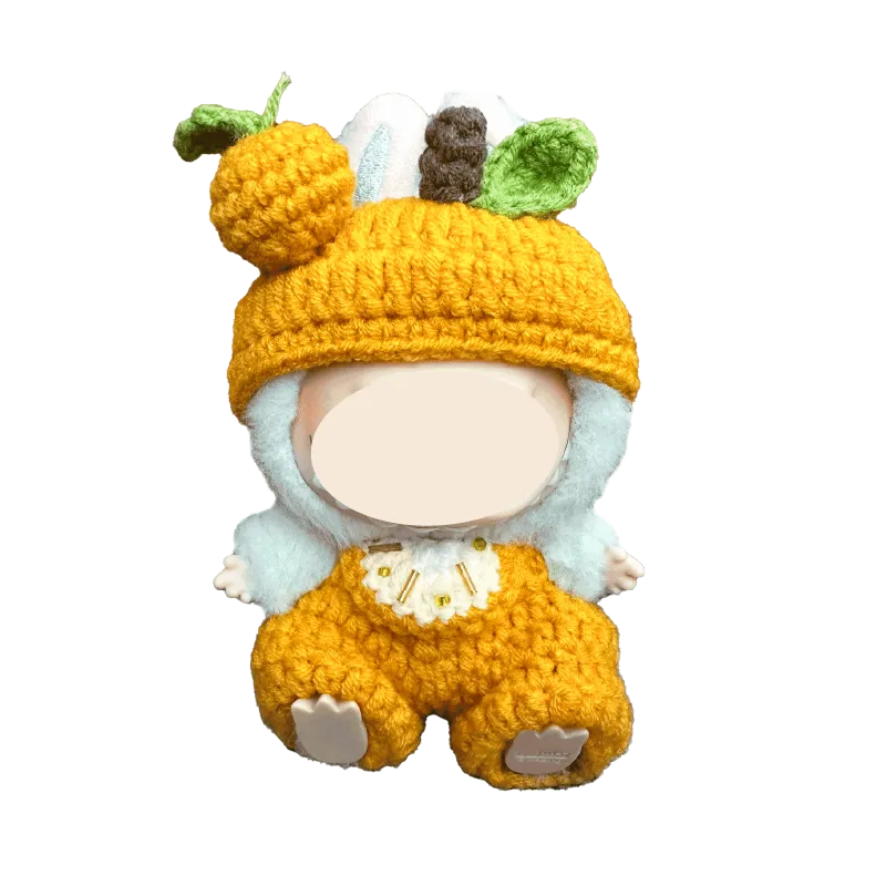 Crochet orange plush outfit pattern featuring a handmade doll outfit with pumpkin hat and overalls