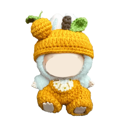Crochet orange plush outfit pattern featuring a handmade doll outfit with pumpkin hat and overalls