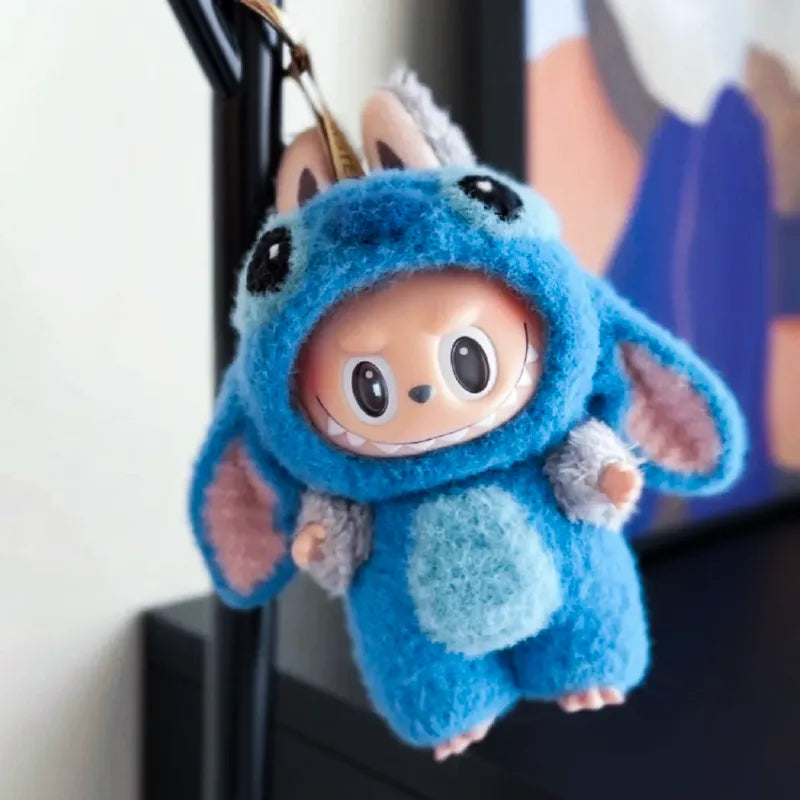Cute blue crochet plushie wearing a character onesie showing crochet pattern for 17cm plushie