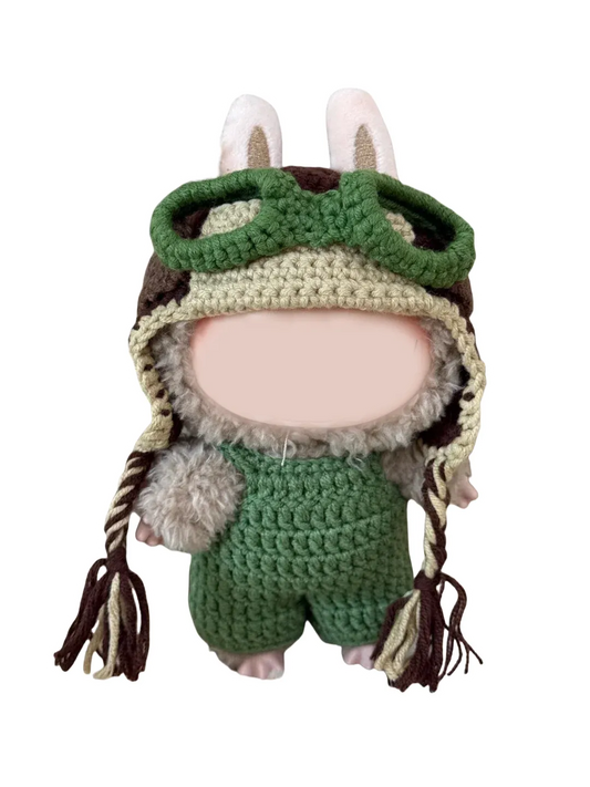 Handcrafted amigurumi doll wearing a crochet pilot hat pattern with green goggles and bunny ears