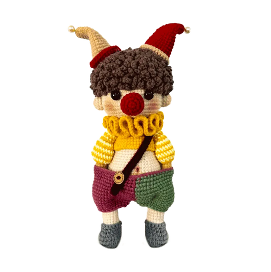 Handmade crochet clown doll with colorful hat and striped sweater for DIY amigurumi clown tutorial