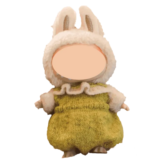The Knit Krazy handmade doll dressed in a fluffy white bunny hood and green knitted outfit