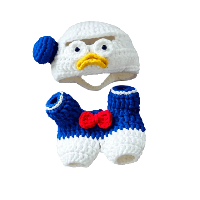 Donald Duck crochet pattern baby hat and shorts set with blue, white, red, and yellow yarn details