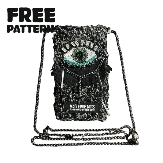 FREE｜cyberpunk crochet phone bag pattern featuring a black crochet design with an eye motif and metallic chain strap