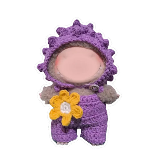 Purple beginner crochet doll outfit with flower accessory on small doll figure