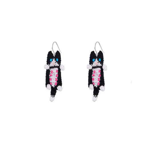 Handmade cat earrings featuring blue and black eye design with fuzzy black and pink fringe accents