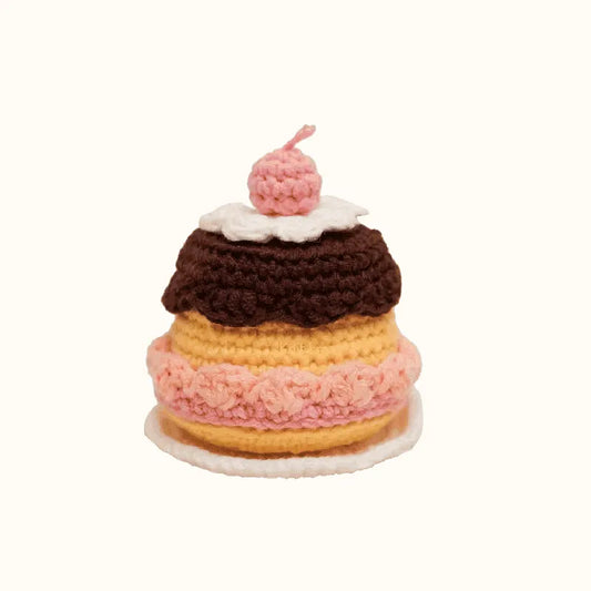 Handmade crochet caramel pudding pattern with chocolate topping and pink cherry on top by The Knit Krazy