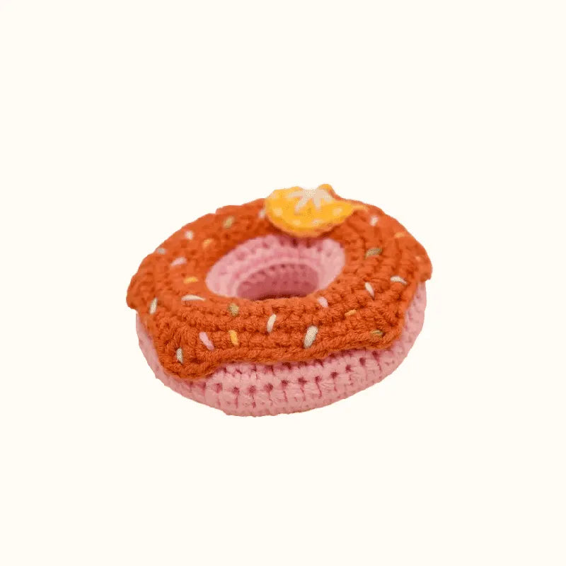 Handmade crochet donut with orange frosting and sprinkles using crochet donut pattern by The Knit Krazy