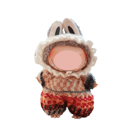 Cute knitted doll wearing bunny ears romper made with knitted doll romper pattern by Redbook