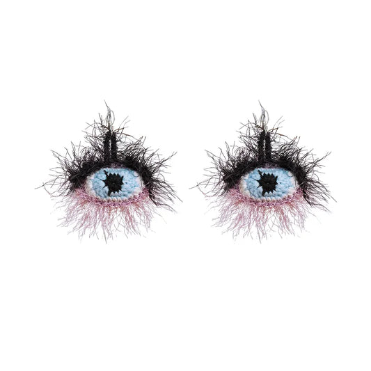 Small yellow banana handmade surrealist eye earrings with black fuzzy lashes and blue iris design