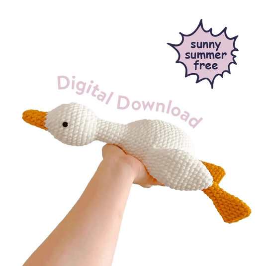 Hand holding a white and orange crochet duck with text digital download for lazy duck amigurumi tutorial