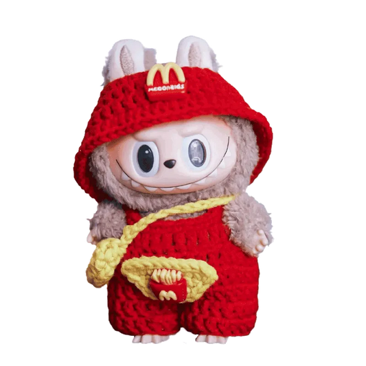 Crochet fast food doll outfit pattern featuring red hat and overalls with yellow details on a fluffy doll