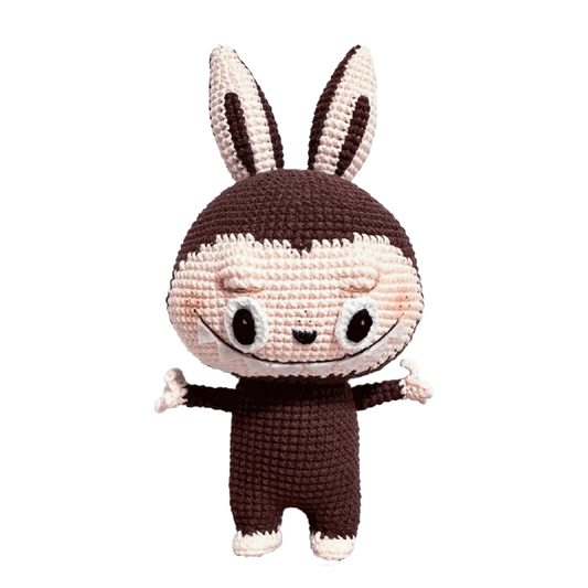 Redbook crochet doll featuring Zimomo inspired crochet pattern with brown and cream yarn details